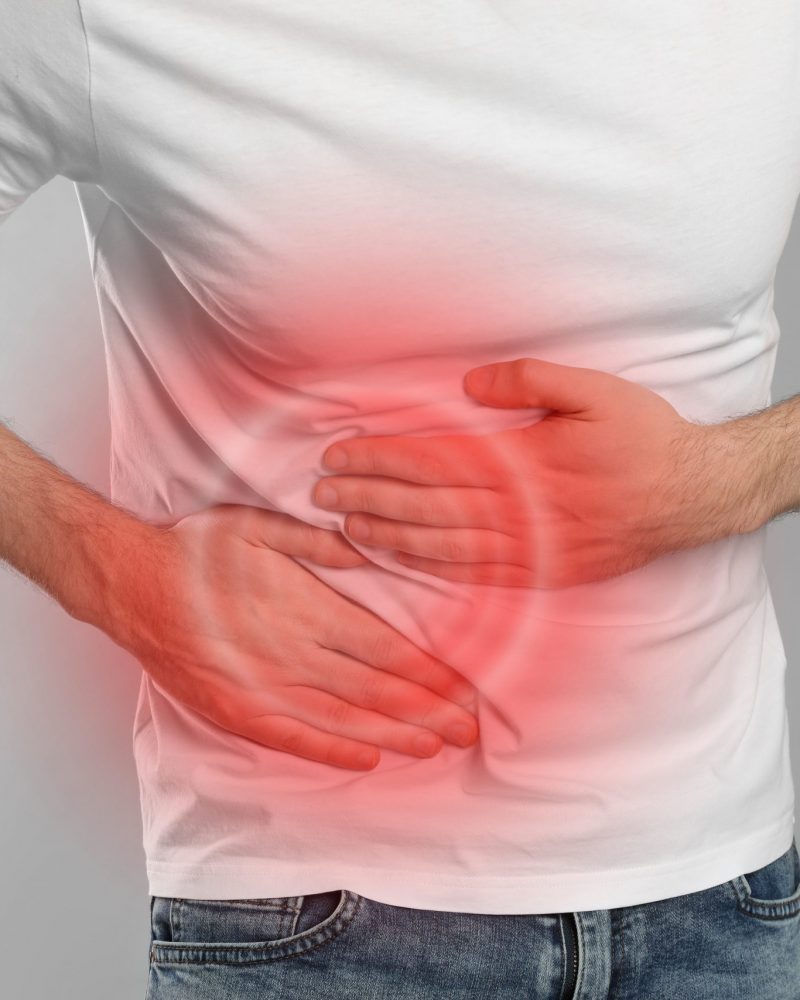 Man,Suffering,From,Pain,In,Lower,Right,Abdomen,On,Light